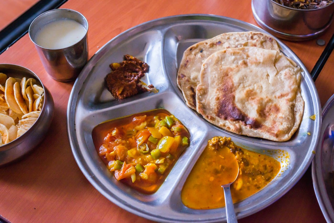 A freshly plated campus meal packed for delivery